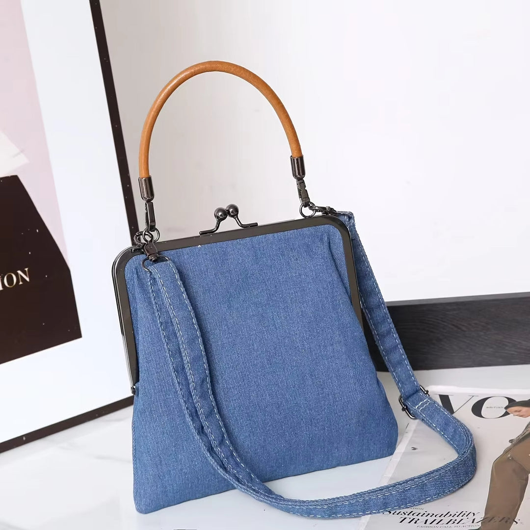 Modern vintage women's handbag: light wash denim frame shoulder bag with premium leather handle and unique clasp.