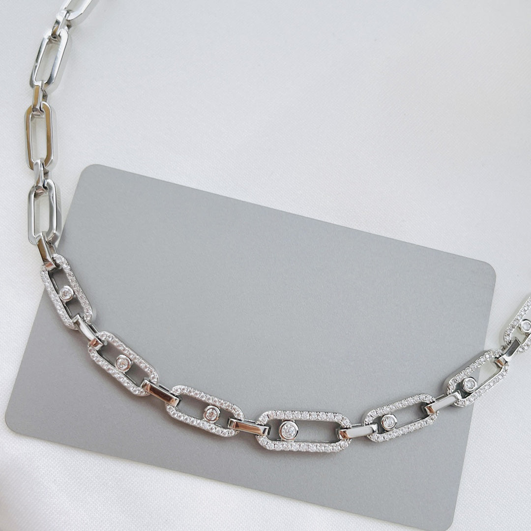 Woman models an elegant Diamond Fusion choker necklace, multi-diamond ring design, stunning white gold finish.