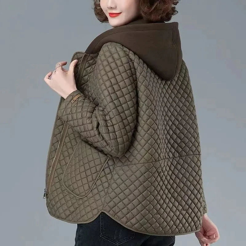 Women's diamond quilted lightweight coat, perfect transitional outerwear with a stylish asymmetrical hem.