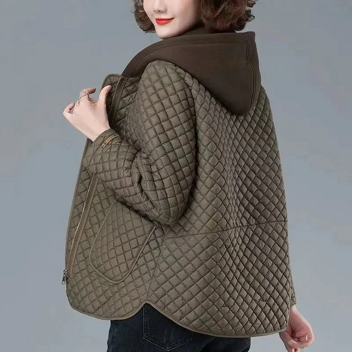 Women's diamond quilted lightweight coat, perfect transitional outerwear with a stylish asymmetrical hem.