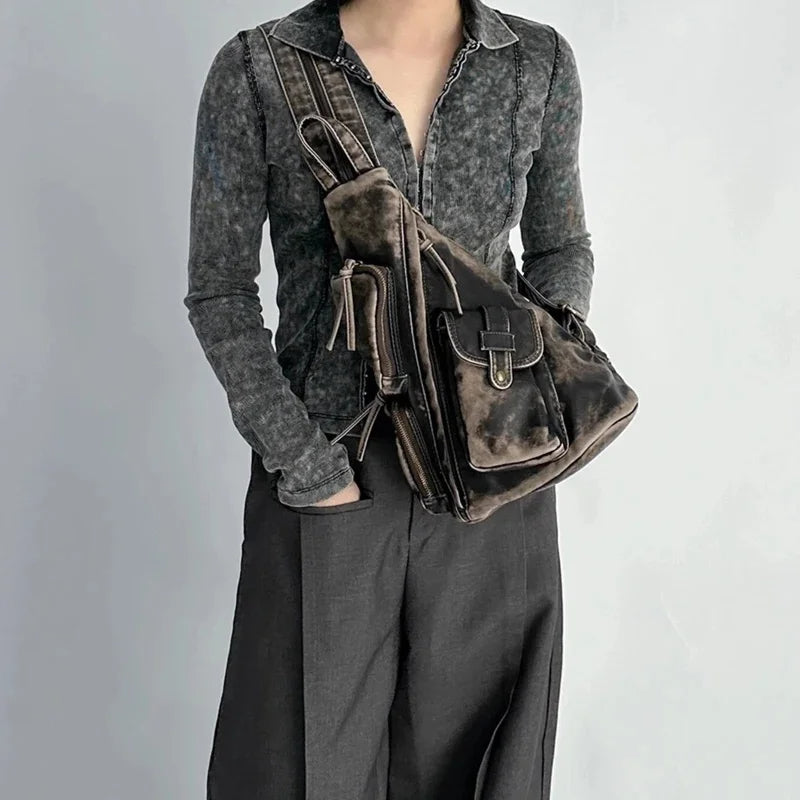Stylish women's distressed convertible backpack, ideal for travel. Transforms into a sling or chest bag.