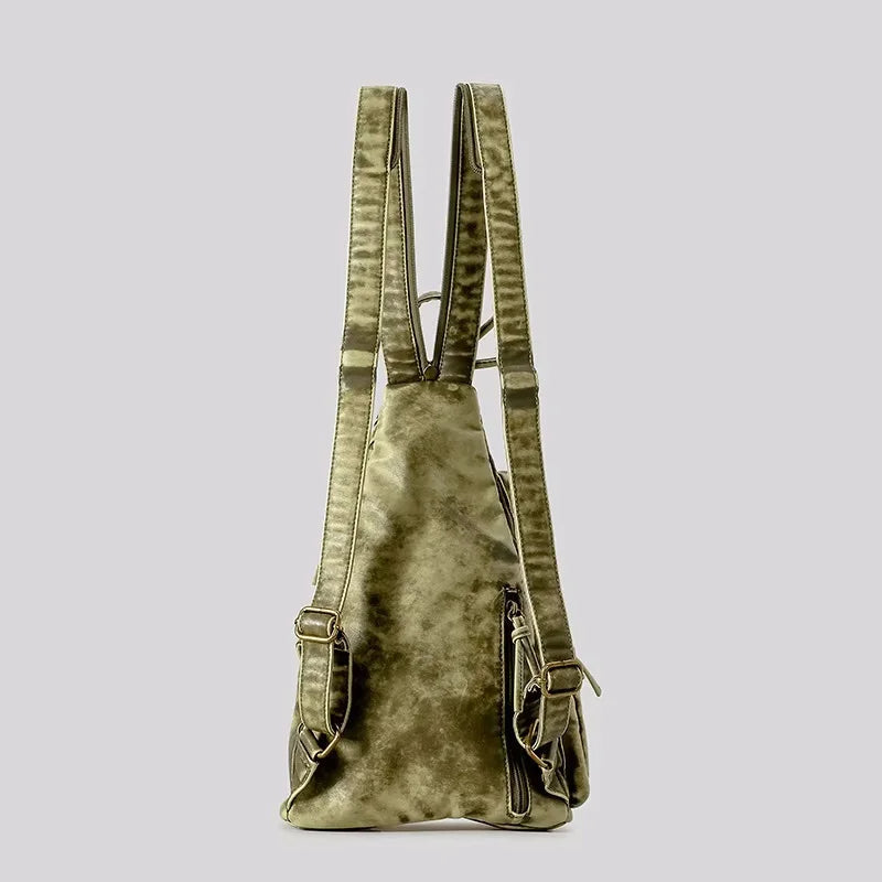 Fashion-forward women's versatile backpack. Distressed finish, converts to sling or chest bag. Essential travel accessory.