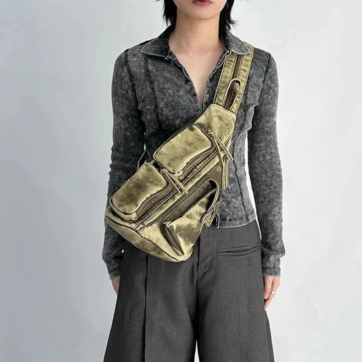 Practical women's convertible backpack with a distressed look. Wears as a sling bag, chest bag, or travel backpack.