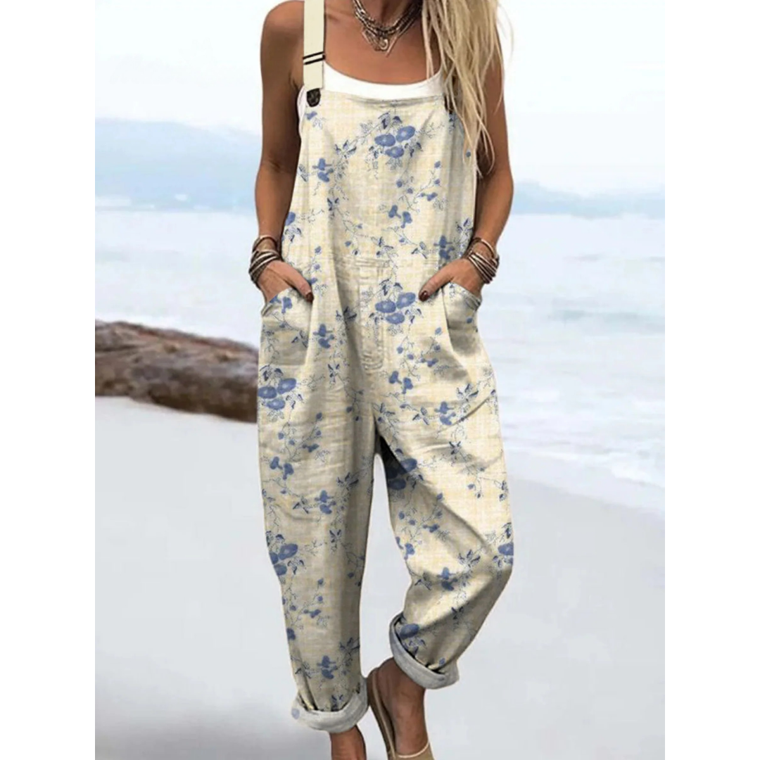 Women's ditsy floral boho jumpsuit with adjustable straps, pockets & relaxed fit. Perfect for summer casual wear.