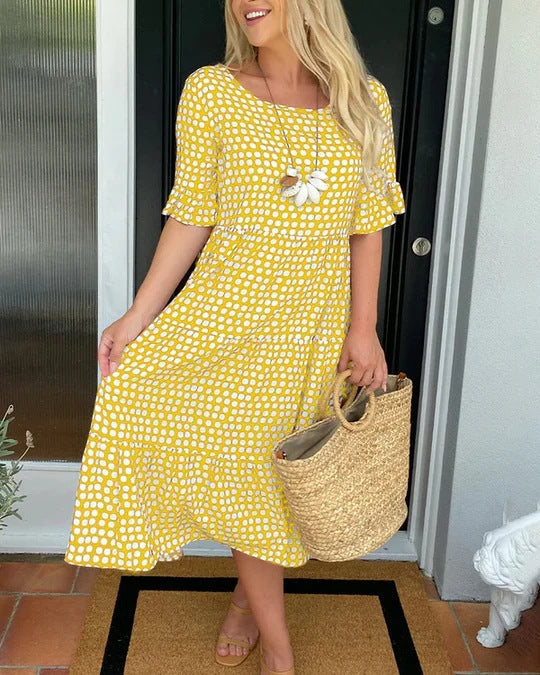 Elegant women's tiered dotted midi dress. Comfortable and versatile for spring & summer occasions.