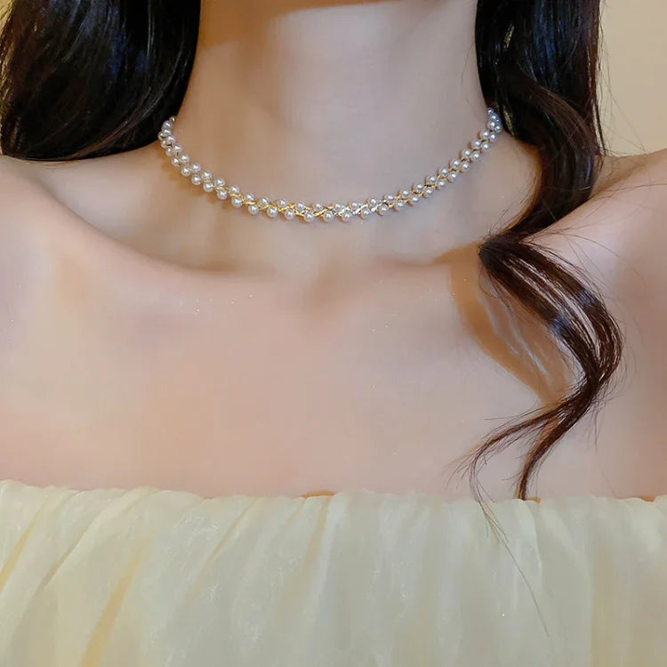 Women's double-layered necklace with sparkling crystals & lustrous pearls. Elegant fashion jewelry accessory.