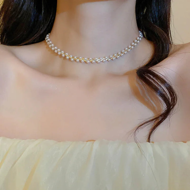 Women's double-layered necklace with sparkling crystals & lustrous pearls. Elegant fashion jewelry accessory.