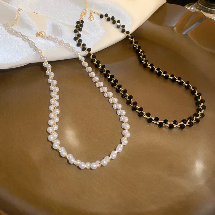 Chic women's layered pearl & crystal necklace. Elegant fashion jewelry, a versatile accessory for women.