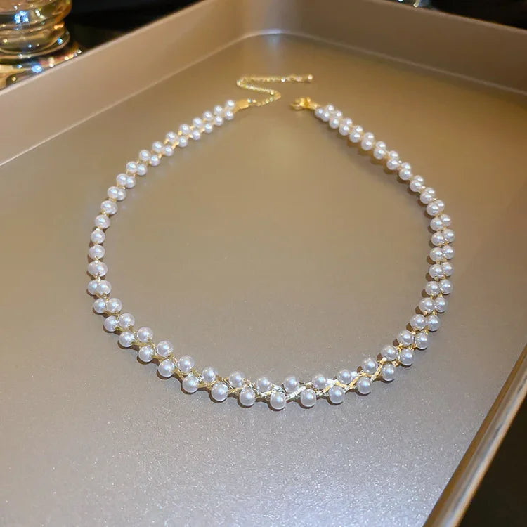 Beautiful women's double-layered necklace, adorned with shimmering crystals and elegant pearls. Fashion jewelry.