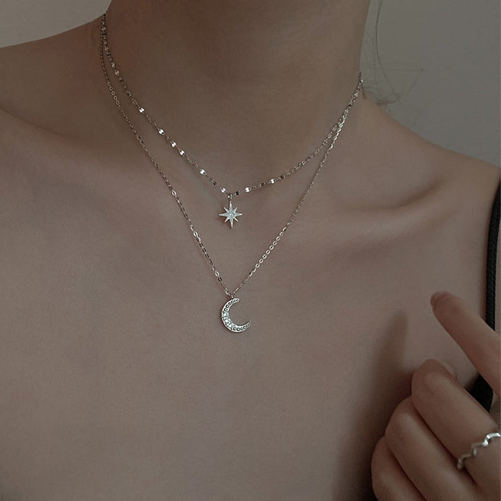 Stylish women's sterling silver double moon layered necklace, a unique celestial pendant, ideal for everyday wear or gifting.