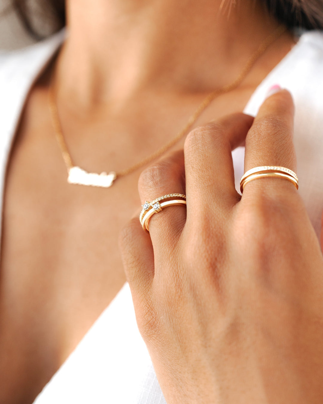 Close-up of a sparkling double zirconia ring. Sterling silver women's jewelry, perfect elegant accessory.