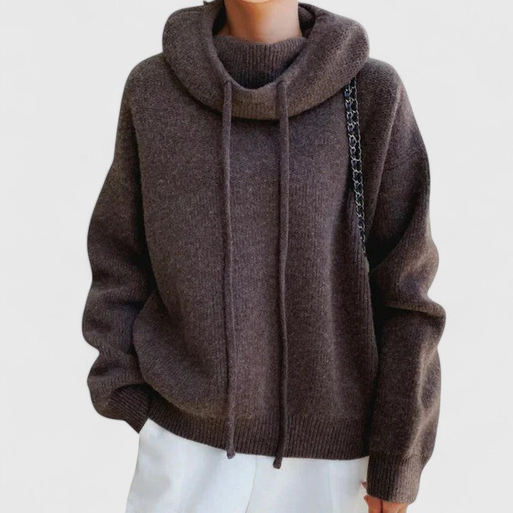 Oversized women's cowl neck pullover sweater with drawstring. Perfect for comfortable everyday wear.