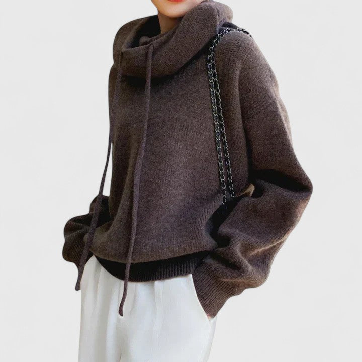 Stylish women's knit sweater featuring a drawstring cowl neck. Ideal for fall & winter outfits.