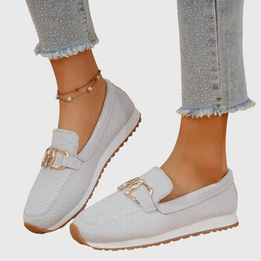 Ladies' dusty blue slip-on loafers. Classic horsebit detail & comfortable design for versatile everyday wear.