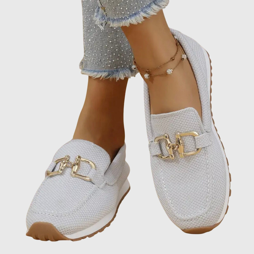Dusty blue women's loafers featuring a horsebit accent. Comfortable slip-on footwear for preppy casual style.