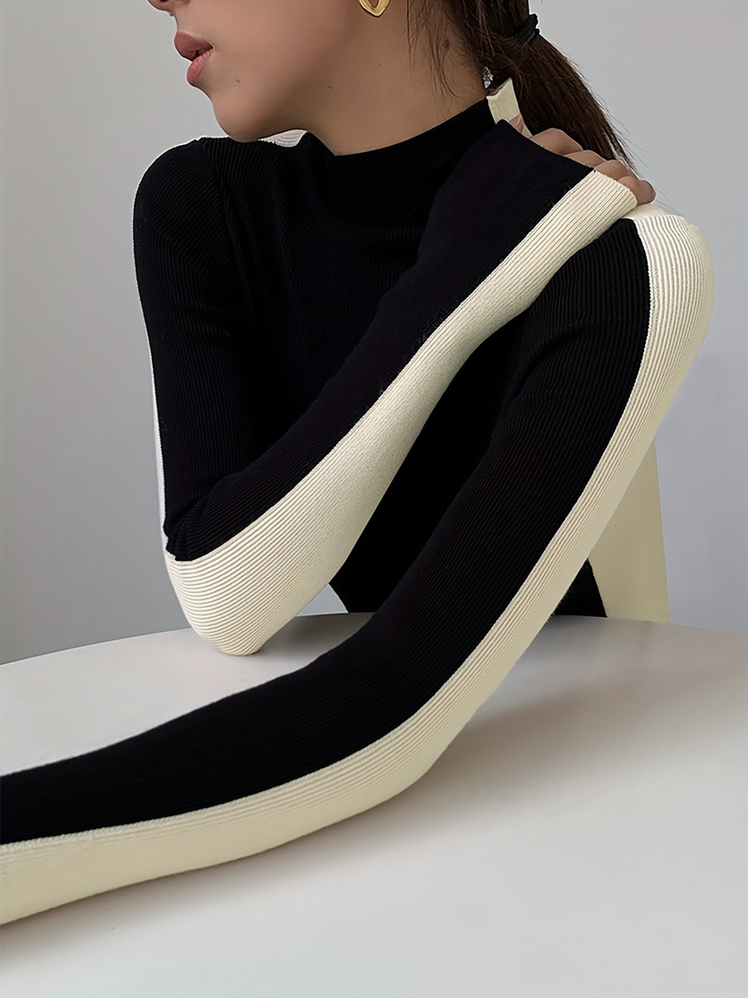 Elegant women's contrast knit turtleneck. Fitted, long sleeve, stretch fabric for comfortable modern layering.