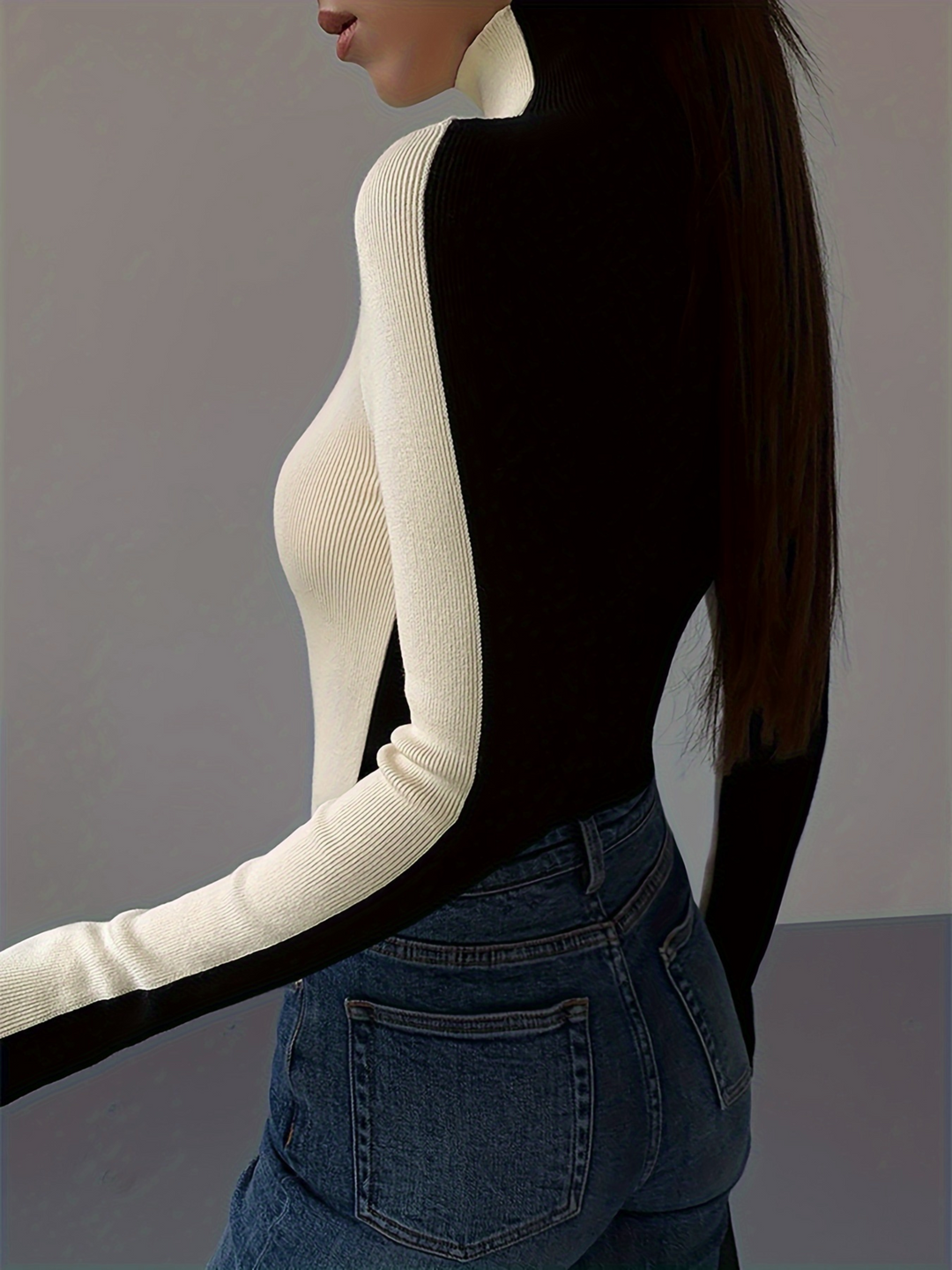 Modern women's fitted stretch knit turtleneck. Long sleeve, contrast details, elegant for versatile styling.