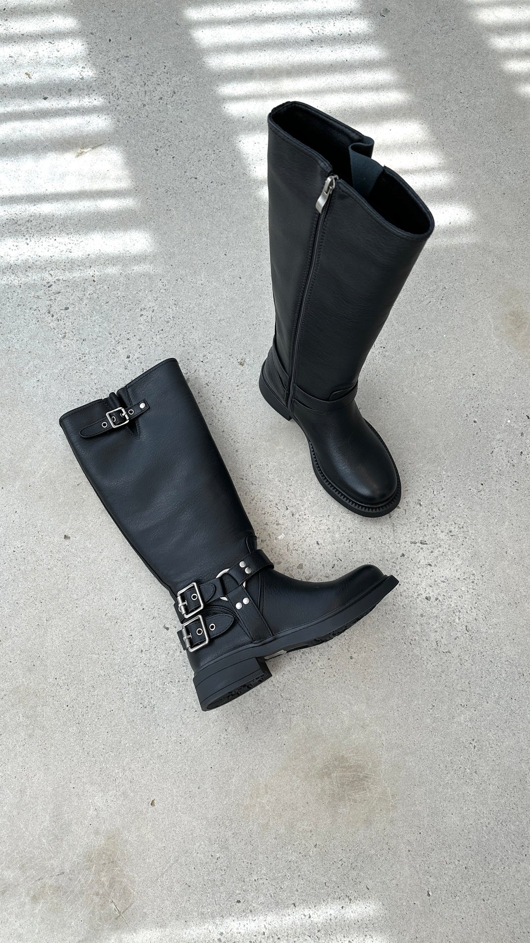 Women's edgy black combat boots with multiple buckles, perfect for punk style & fall fashion.