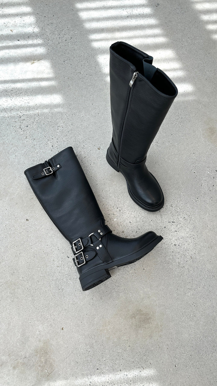 Women's edgy black combat boots with multiple buckles, perfect for punk style & fall fashion.