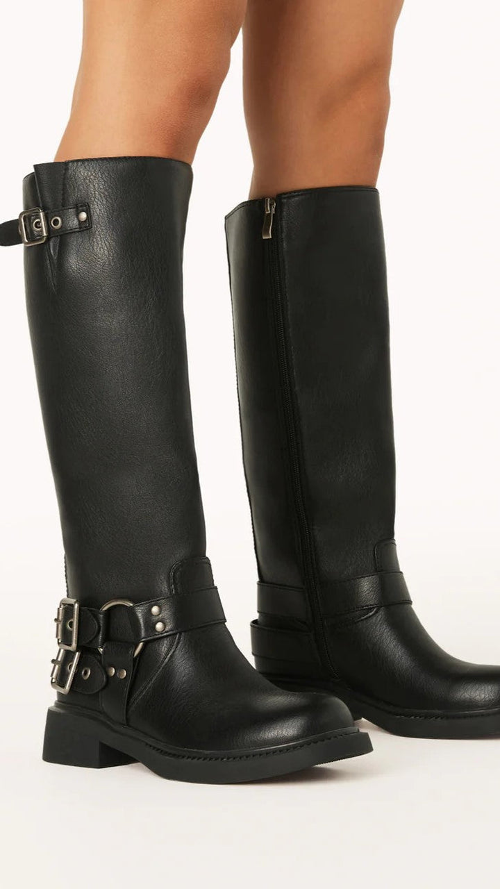 Sturdy black combat boots for women, featuring decorative buckles & a side zipper. Ideal for winter.