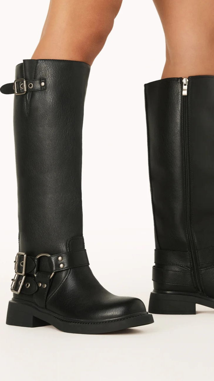 Chic women's black combat boots with edgy buckles & a side zipper, ideal for cool weather fashion.