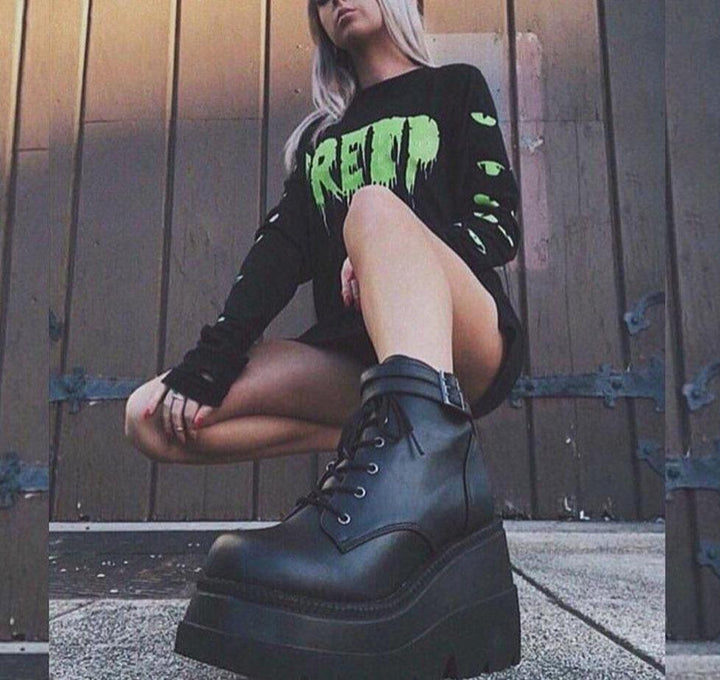Chunky black platform ankle boots for women, offering an edgy and alternative style. Ideal combat boots.