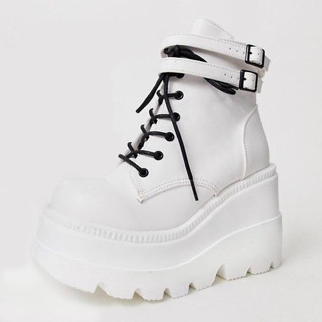 Bold women's black chunky platform ankle boots. Edgy design for alternative style or gothic outfits.