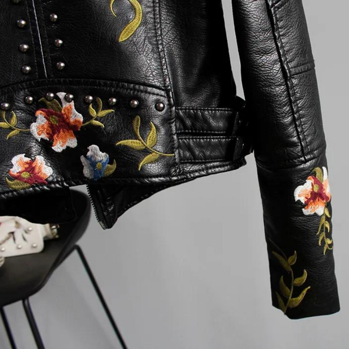White edgy women's jacket, floral embroidered with studs, for a bold fashion look.
