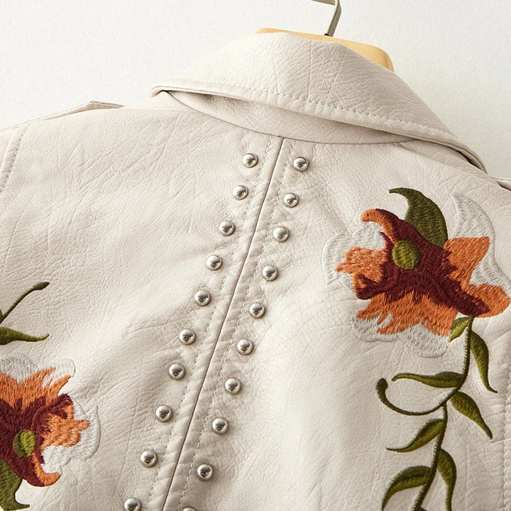 Statement women's edgy jacket, black, floral embroidery, studded accents & bold look.