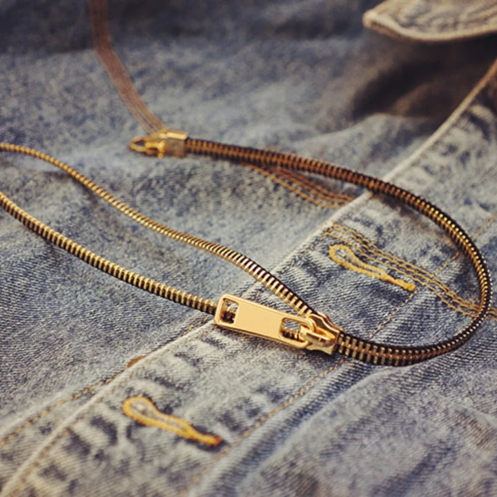 Glamorous gold-tone zip chain statement necklace for women, an edgy and unique accessory.