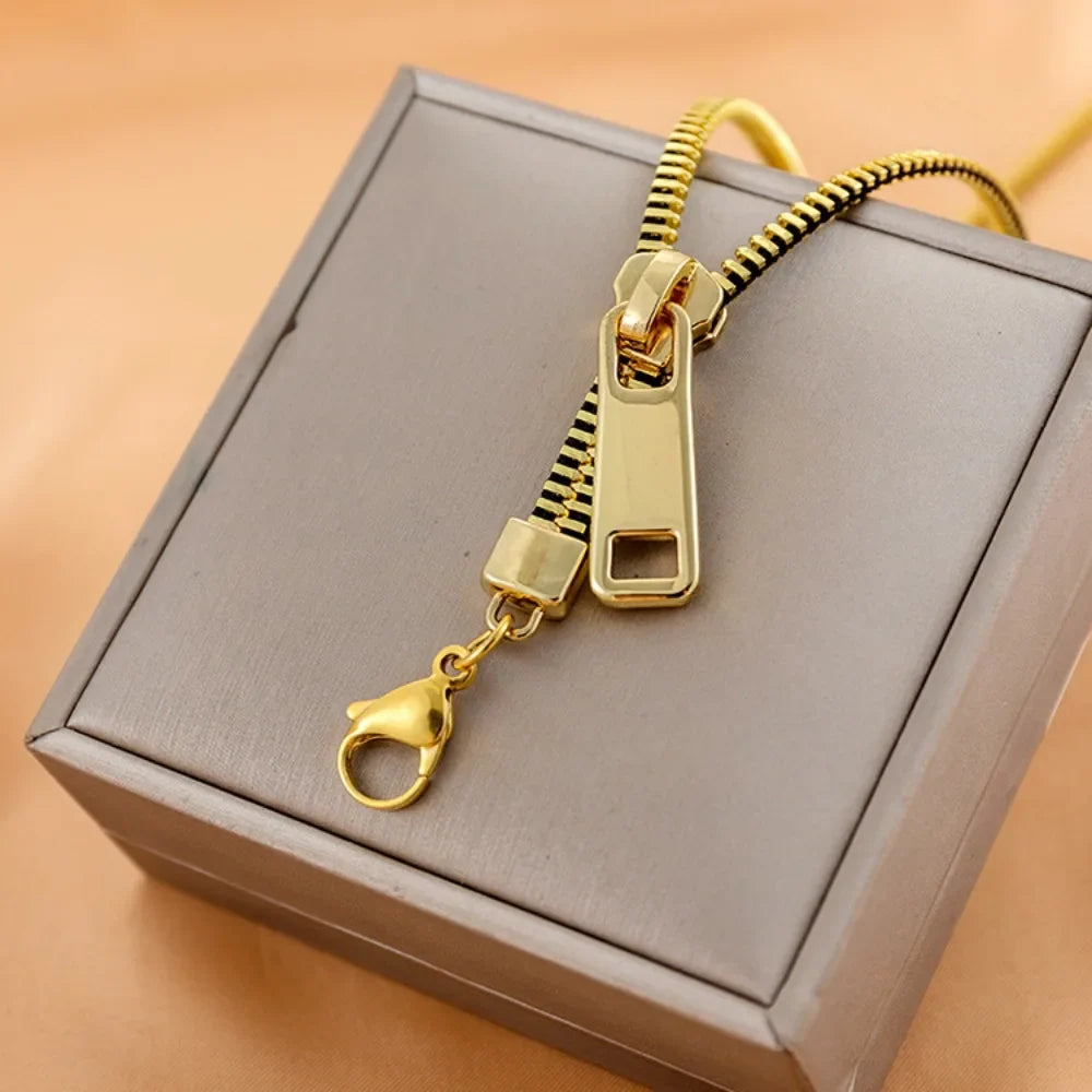 Close-up of a women's zip chain statement necklace, showcasing its edgy metallic links in silver.