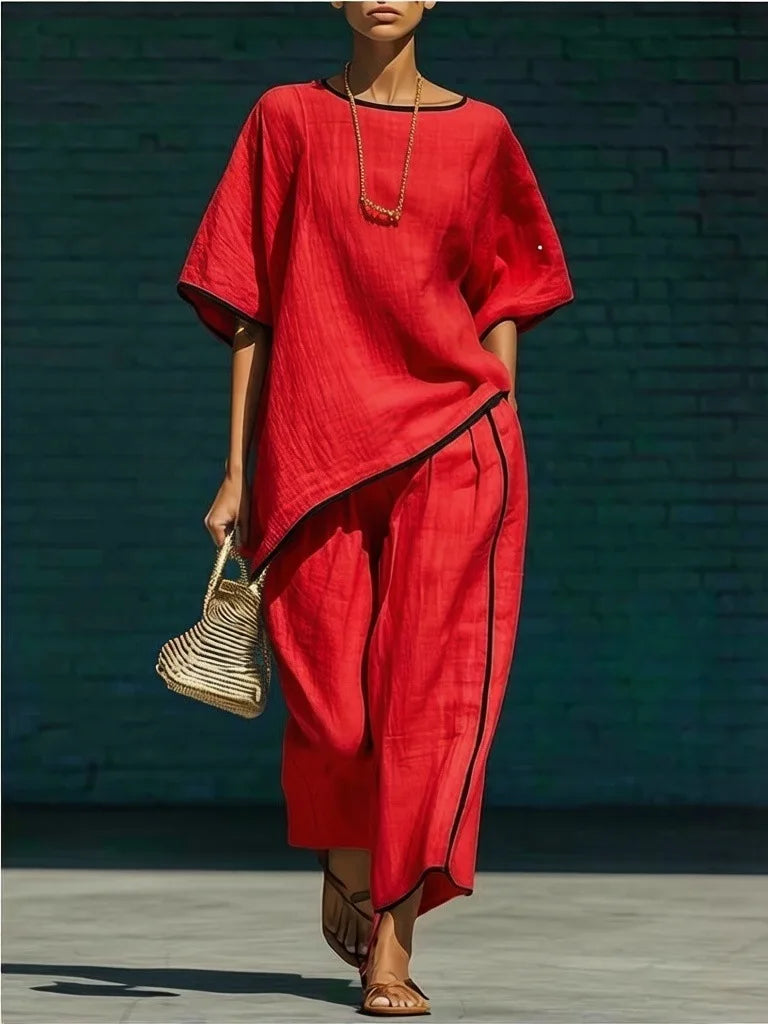 Stylish women's cropped top & wide-leg pant set. Comfortable two-piece outfit for spring, summer, or casual elegant wear.