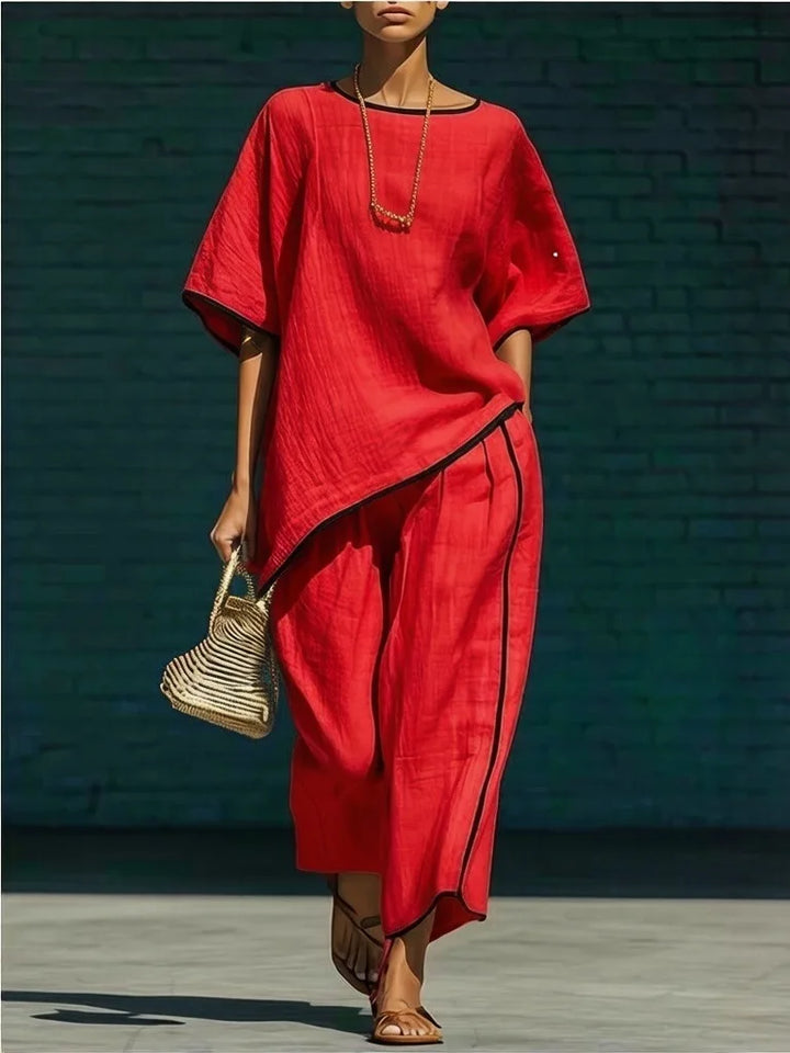 Stylish women's cropped top & wide-leg pant set. Comfortable two-piece outfit for spring, summer, or casual elegant wear.