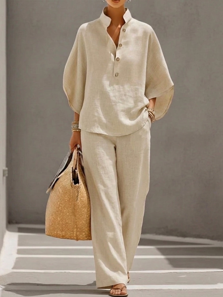 Women's effortless batwing blouse and wide trousers two-piece set for casual chic style.