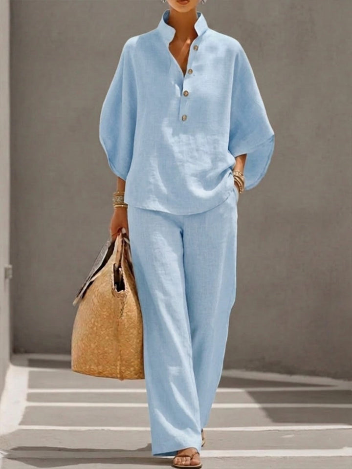 Comfortable women's batwing blouse & wide leg trousers set, perfect for versatile spring/summer outfits.