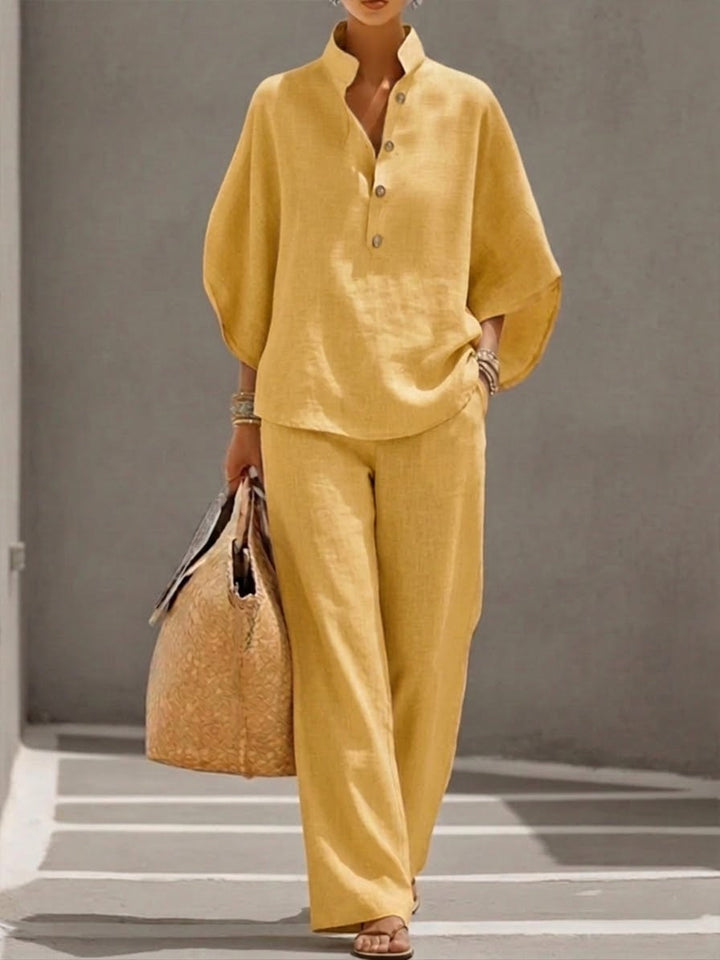 Relaxed fit women's two-piece set with a batwing blouse and wide leg trousers for ultimate comfort.