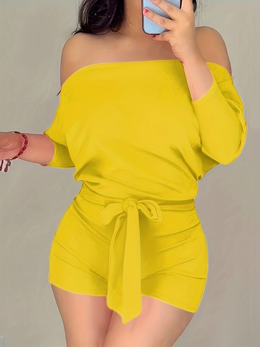 Elegant batwing short romper for women. Versatile for vacation, resort, or comfortable everyday summer fashion.