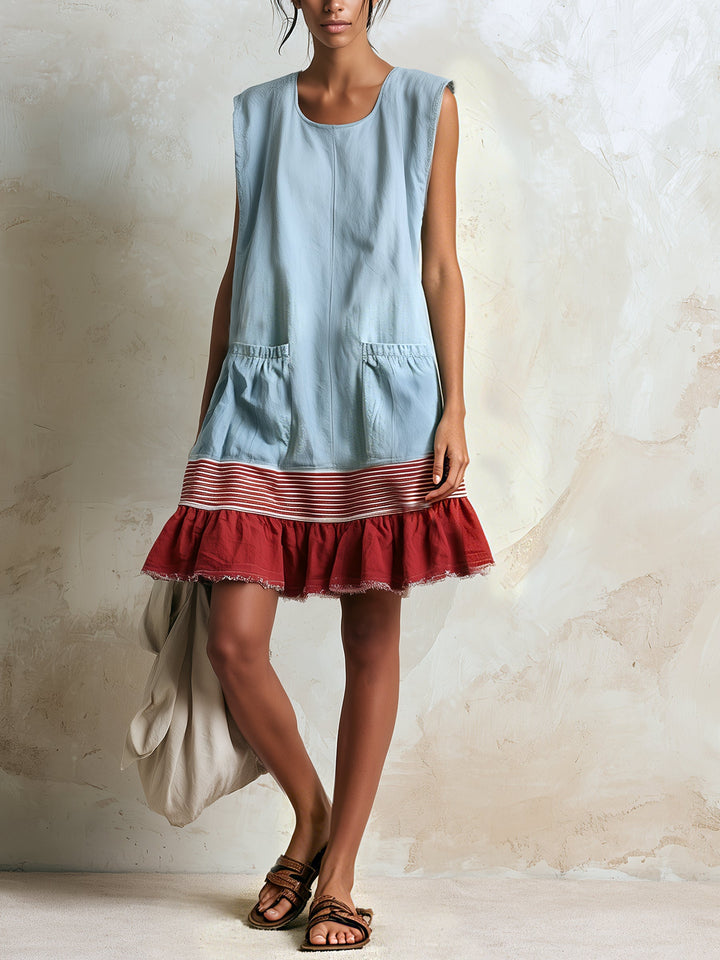 Chic blue tiered mini dress with playful ruffles & contrast details. A comfortable, boho-inspired summer essential.