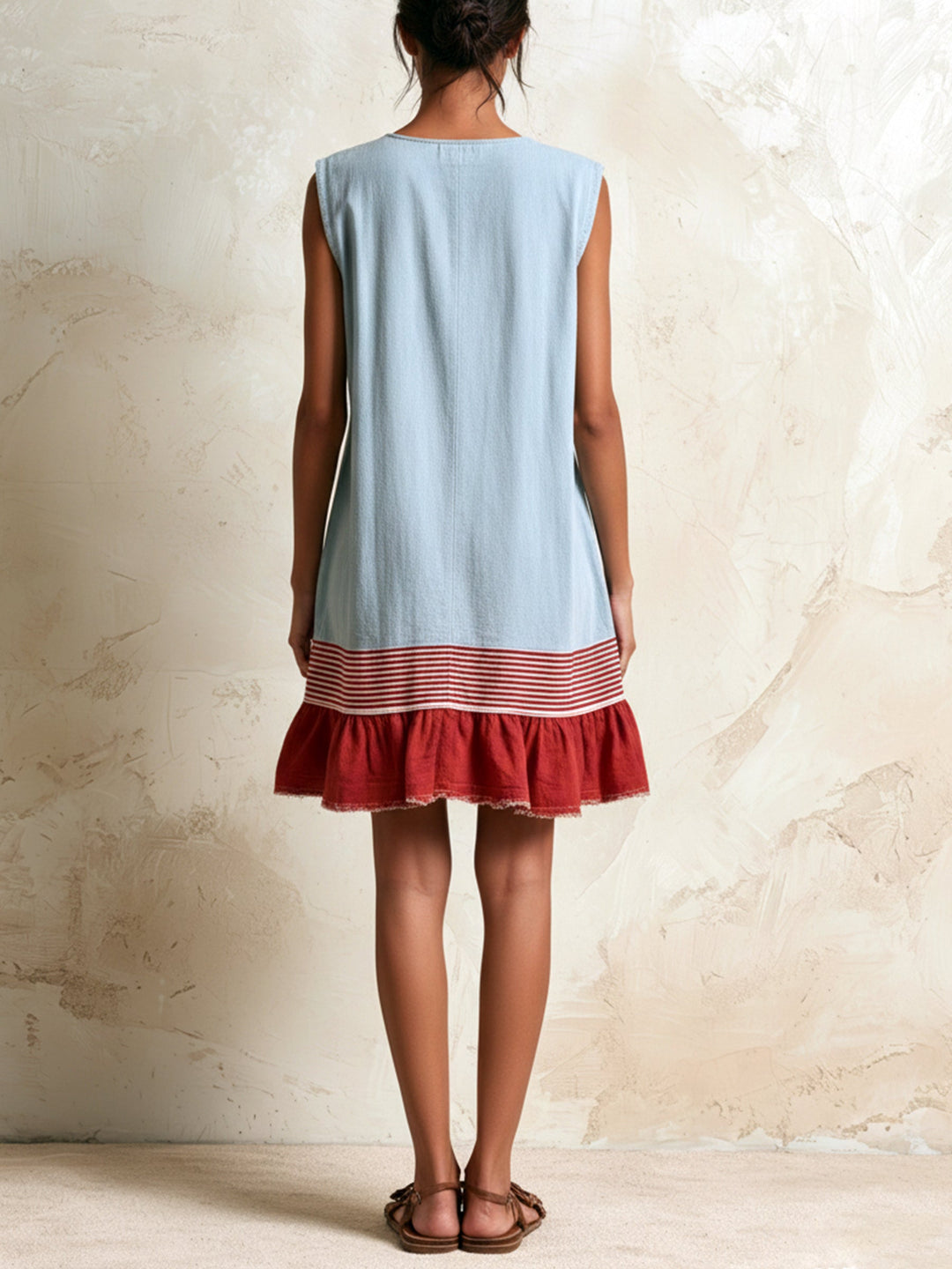 Sleeveless blue mini dress for women, showcasing a stylish ruffle tiered hem with eye-catching contrast trim.