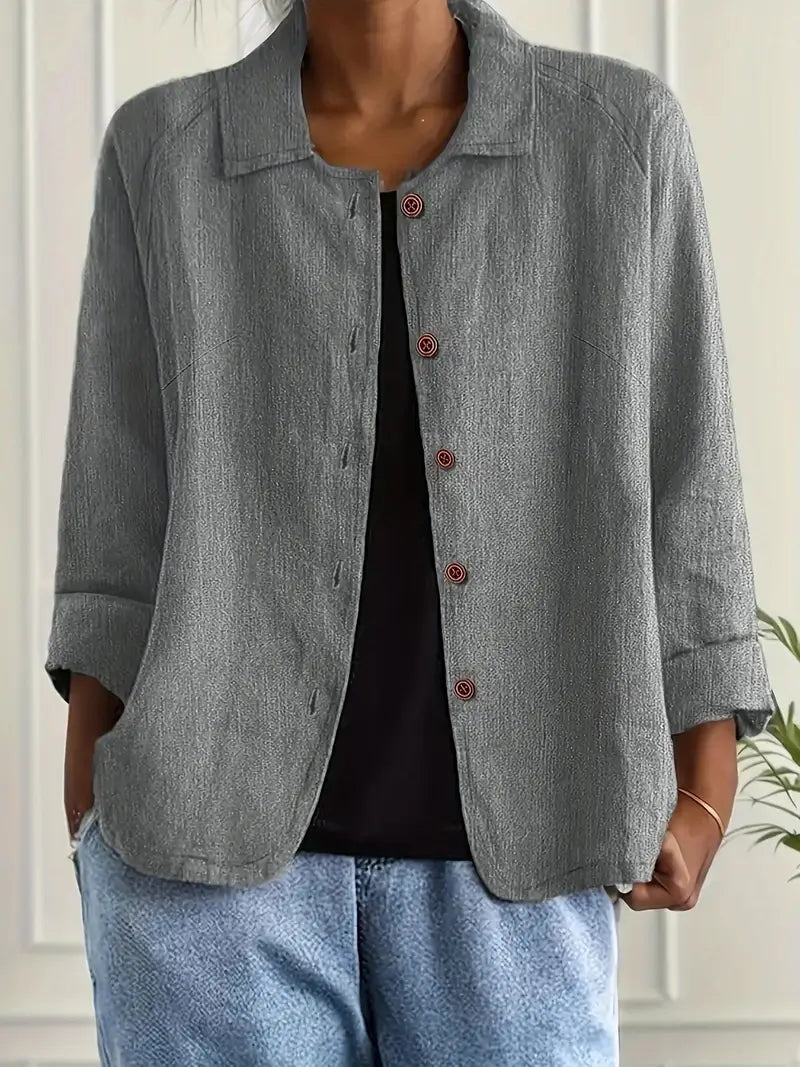 Chic women's three-quarter sleeve button-front top, relaxed fit for versatile spring-summer style.