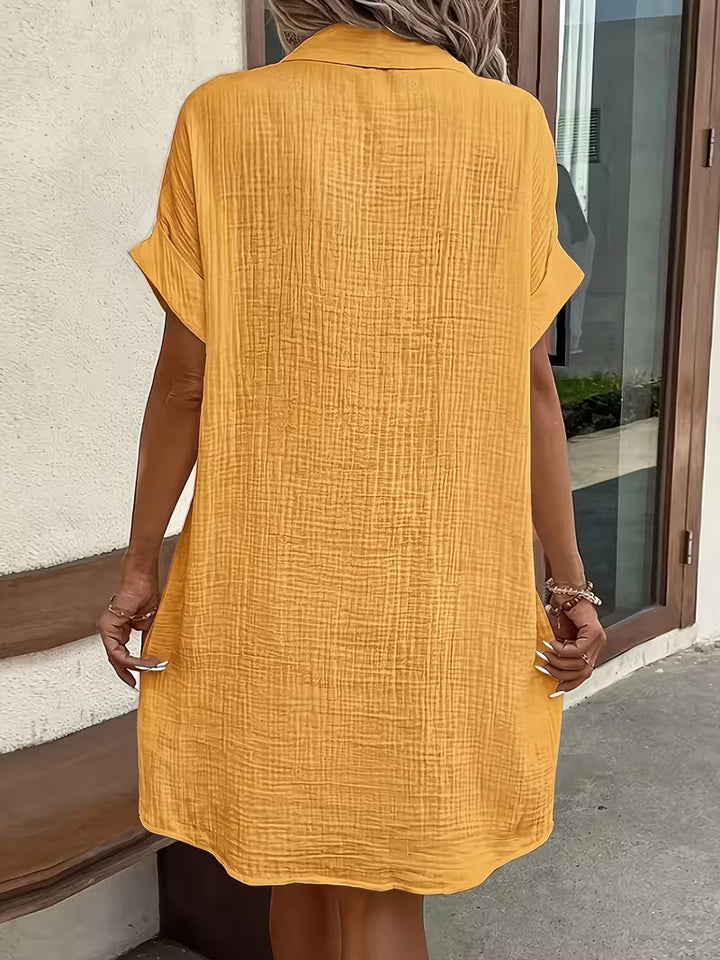 Chic women's button-front shirtdress with pockets, offering versatile style for everyday & vacation.
