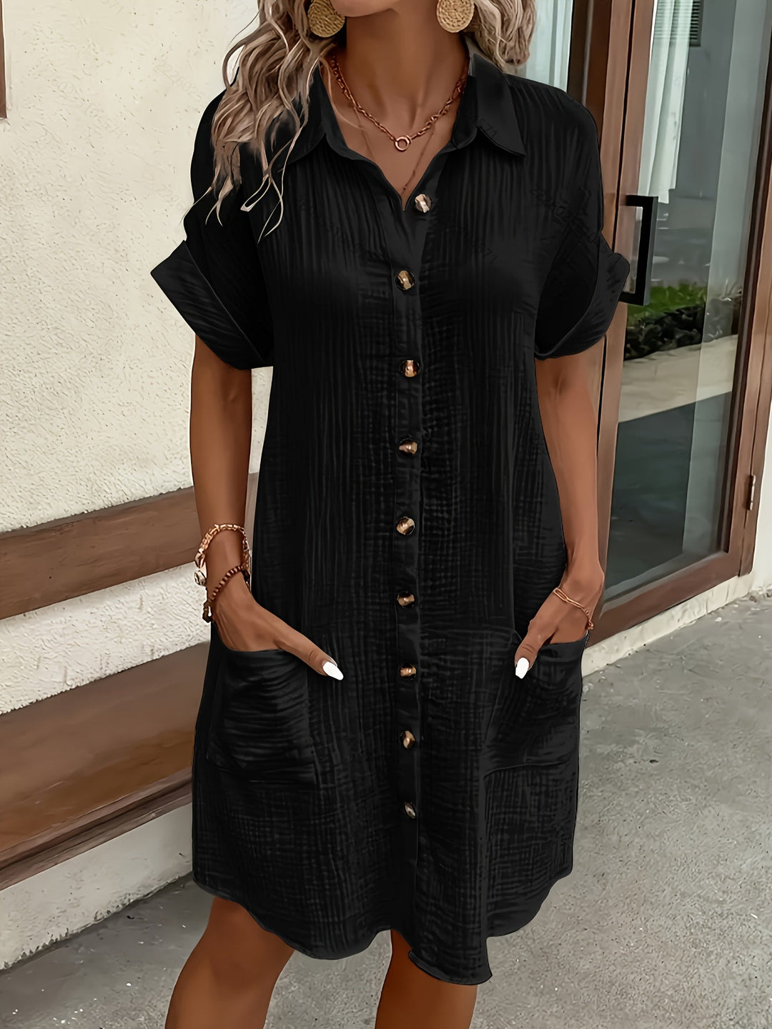 Versatile women's shirtdress, button-front & collared, for elegant everyday wear or a relaxed vacation outfit.