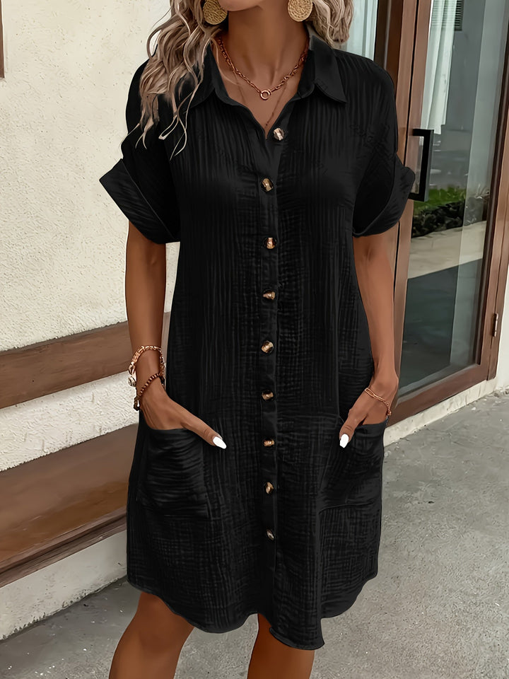 Versatile women's shirtdress, button-front & collared, for elegant everyday wear or a relaxed vacation outfit.
