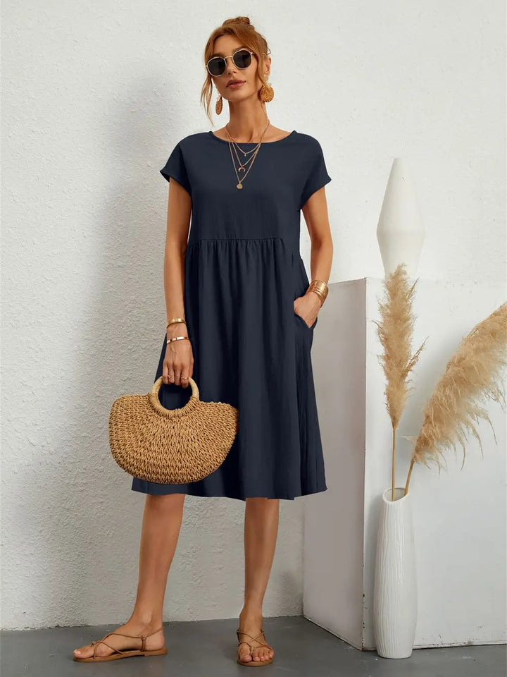 Comfortable women's relaxed fit dress, ideal for versatile everyday wear & summer outings.
