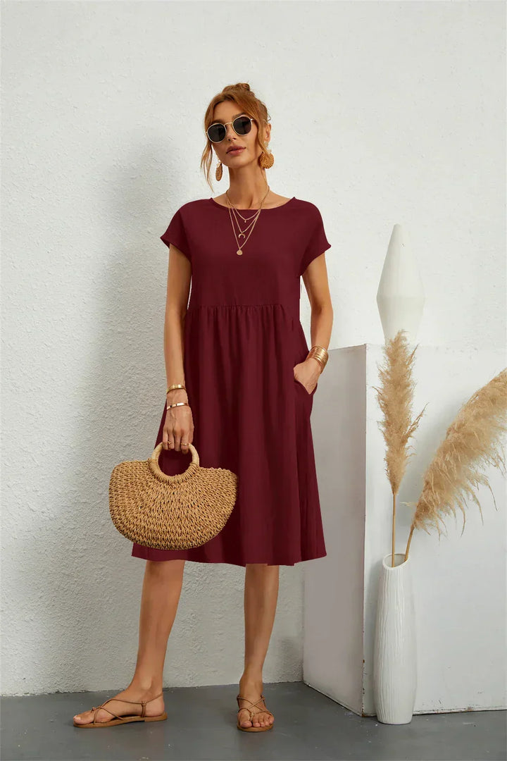 Chic women's casual dress with pockets, relaxed fit providing ultimate comfort and style.