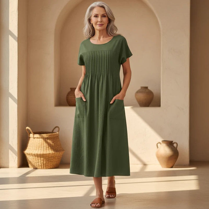 Women's effortless casual relaxed fit midi dress with pockets for all-day comfort and versatile everyday style.