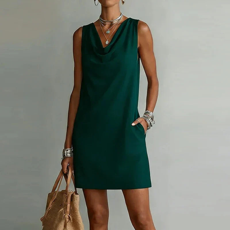 Women's effortless draped neck mini dress with pockets, perfect for summer casual wear or vacation.