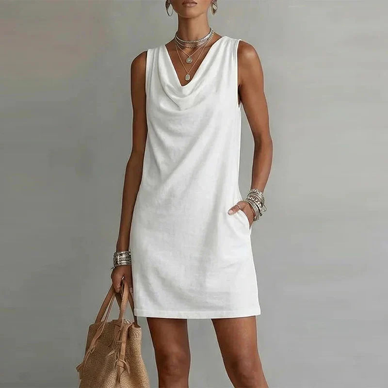 Effortless women's relaxed fit summer mini dress, comfortable draped neck with practical pockets.