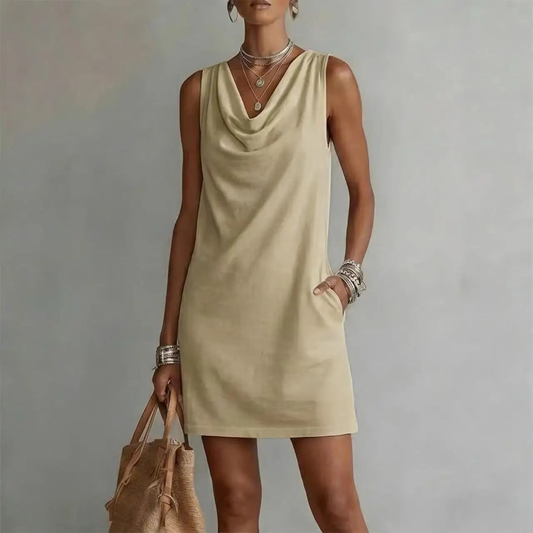 Stylish women's sleeveless mini dress featuring a draped neck, pockets, and a relaxed fit for summer wear.