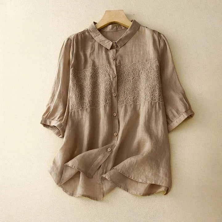 Effortless embroidered button-up shirt for women, a versatile long-sleeve top for elegant casual wear.